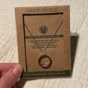 NIB! MantraBand necklace silver tone with phrase “what goes around comes around”